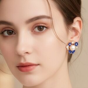 Blue flower and white pearl stud earrings with a bow. 3 Cm